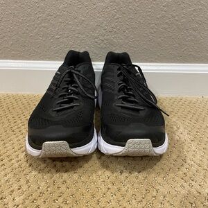 Black HOKA running shoes